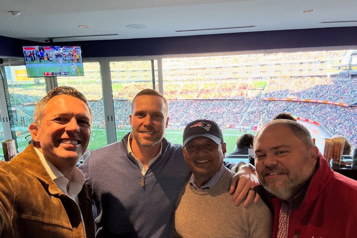 Veritas partners with a client in a stadium suite.